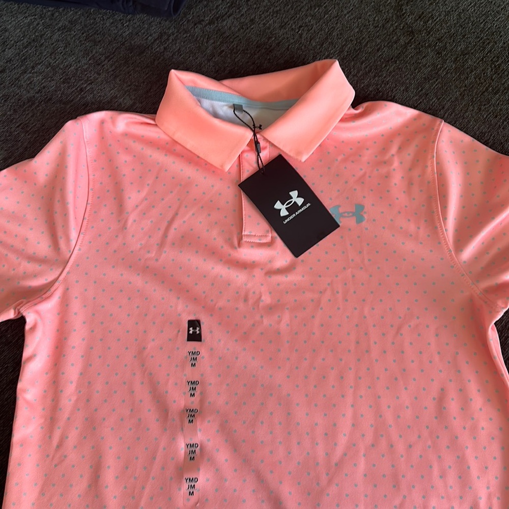 Boys medium Under Armour polo. Light orange/peach with grey polka dots